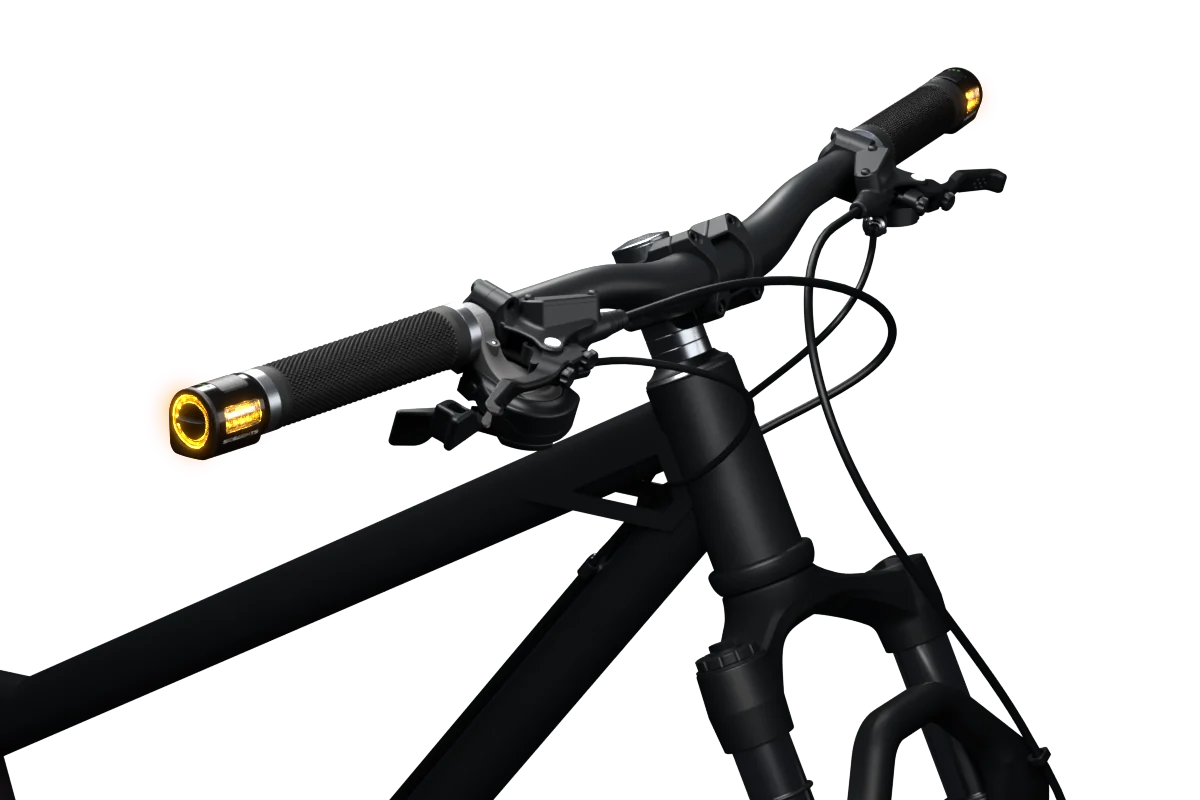 Le guidon équipé de deux SideLights Signal, lumières ambrées allumées.